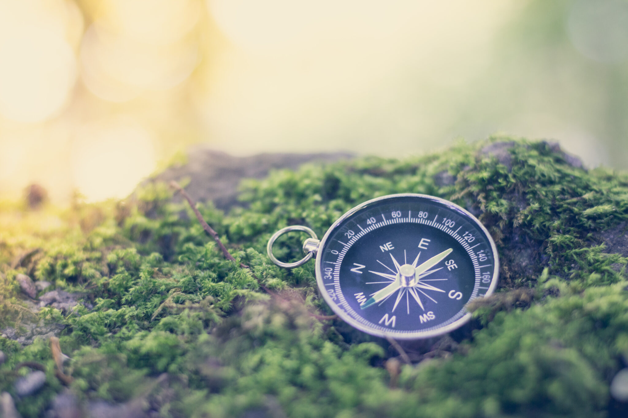 Vintage compass lying on the floor. Adventure and discovery concept. Drought.